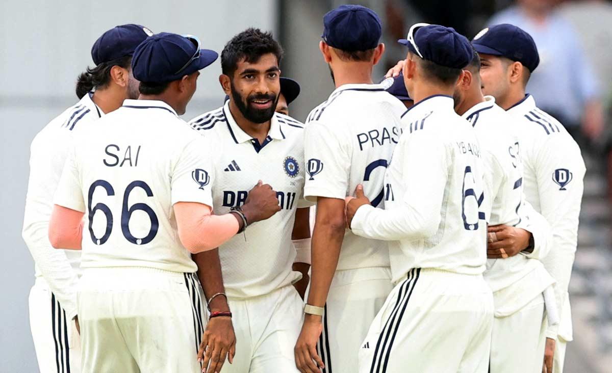 Jasprit Bumrah celebrates with teammates after taking the wicket of England's Zak Crawley