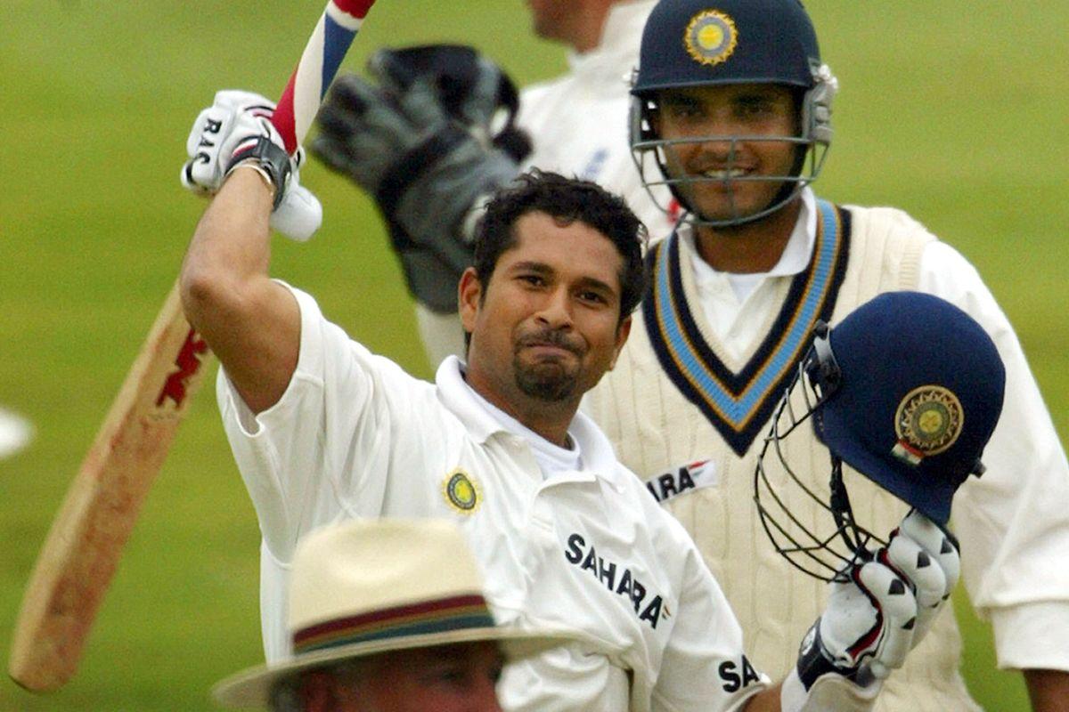 India's Sachin Tendulkar (L) acknowledges his century as Saurav Ganguly (R) looks on during the second day's play of the third Test against England at Headingley in Leeds, on August 23, 2002