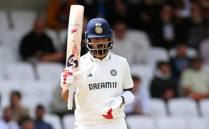K L Rahul celebrates after completing his fifty