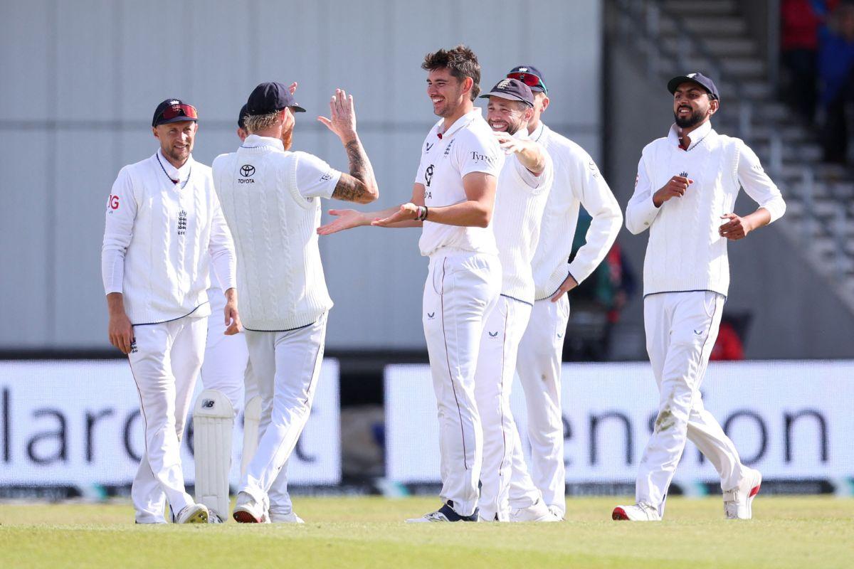 England's Josh Tongue celebrates with teammates after taking the wicket of India's Jasprit Bumrah