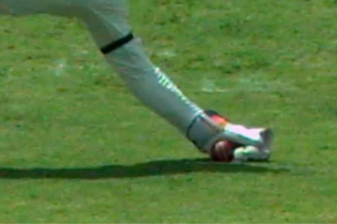 The TV replays showed that Aus keeper Carey had grassed the ball, but the umpire deemed the catch clean, leading to the dismissal of Shai Hope