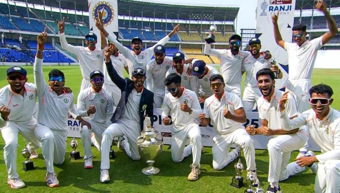 Vidarbha's  players pose for a picture after defeating Kerala in the Ranji Trophy final in Nagpur on Sunday.