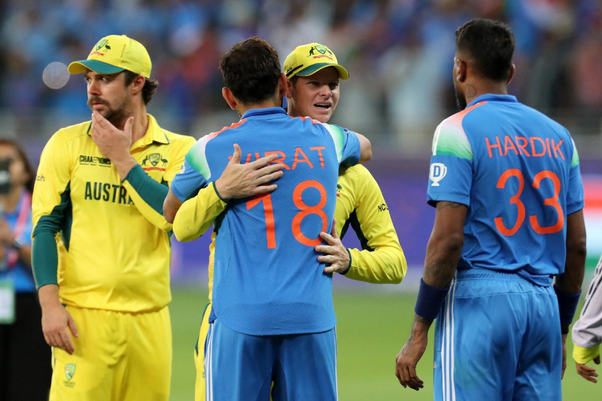 Steve Smith hugs Virat Kohli after India beat Australia to win the ICC Champions Trophy semi-final on Tuesday