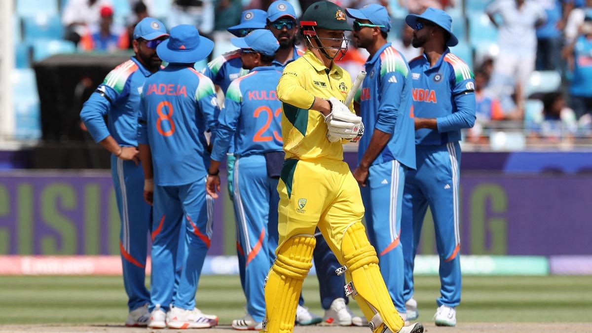 Australia opener Cooper Connolly walks back to the pavilion after being caught by wicketkeeper K L Rahul off the bowling of Mohammed Shami in the Champions Trophy semi-final in Dubai on March 5