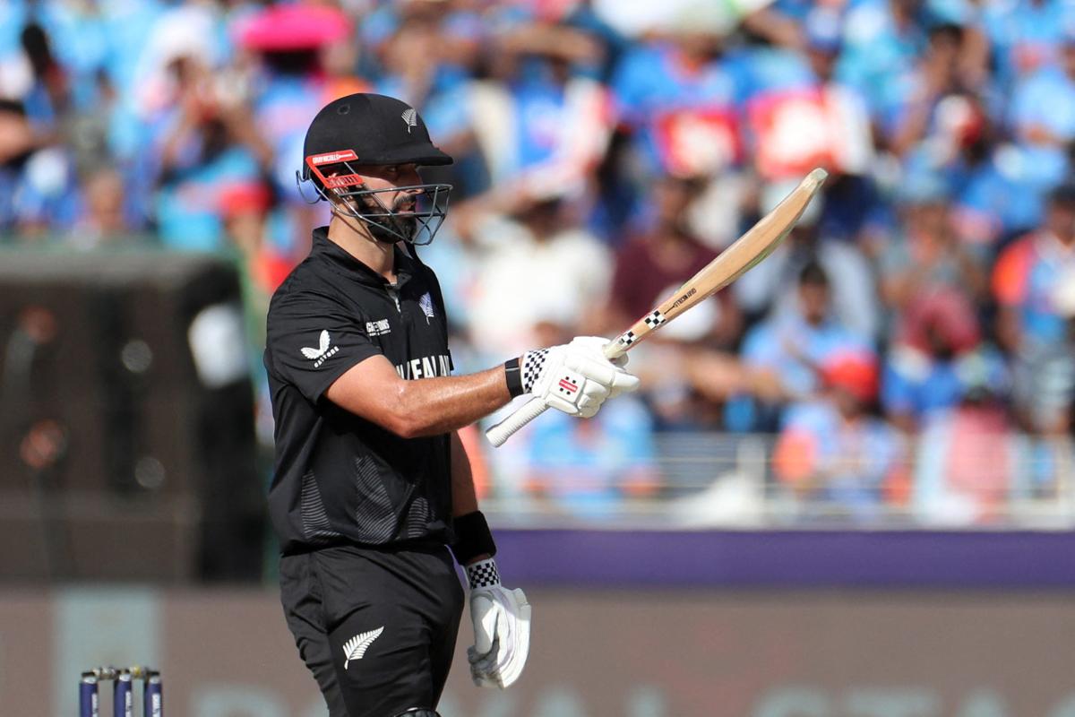 New Zealand's Daryl Mitchell celebrates after reaching his half century 