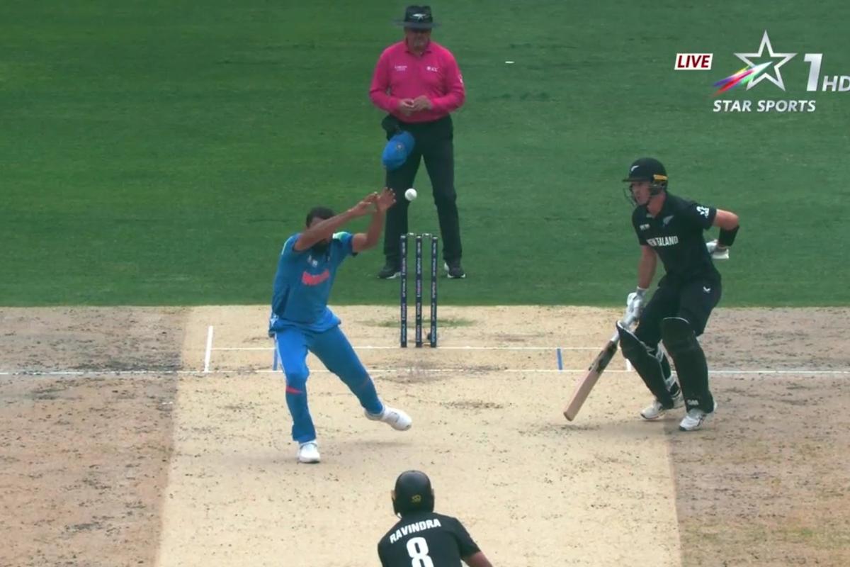 Mohammed Shami puts down Rachin Ravindra on his follow through in the 7th over