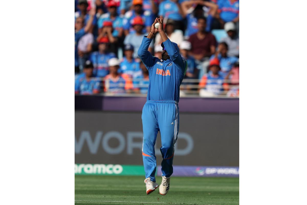 Rohit Sharma takes a catch to dismiss Daryl Mitchell off the bowling off Mohammed Shami