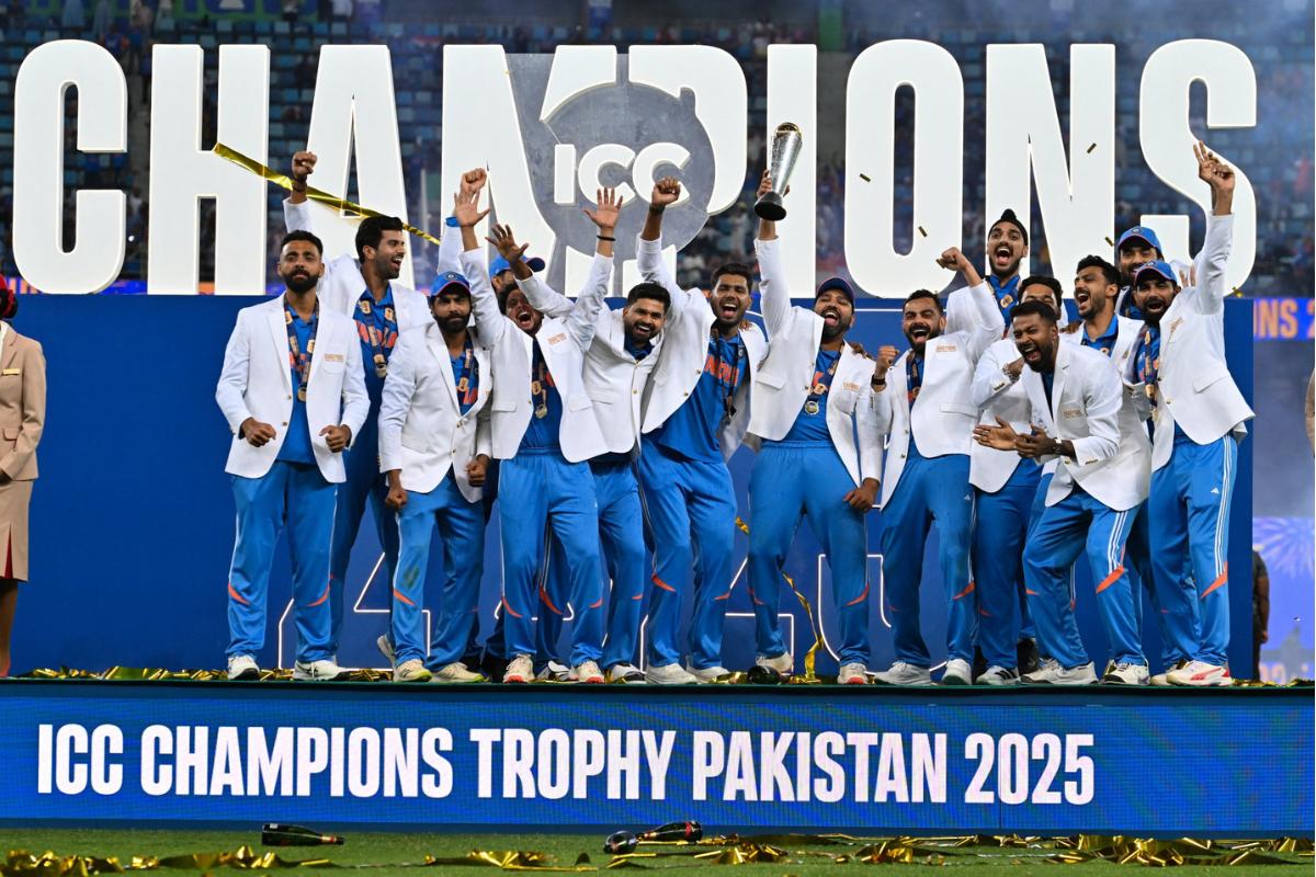 India players celebrate with the trophy on the podium after defeating New Zealand in the final to win the ICC Men's Champions Trophy on Sunday, March 9