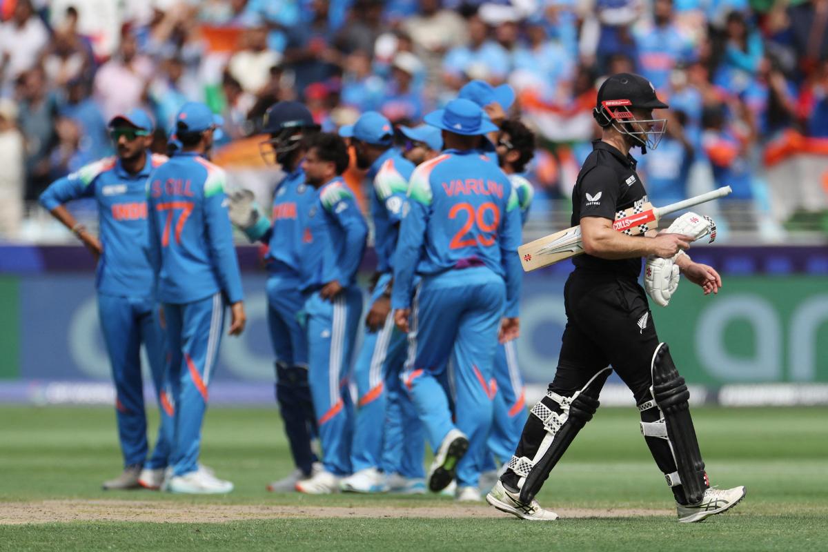 Kane Williamson walks back after being dismissed by Kuldeep Yadav for 11