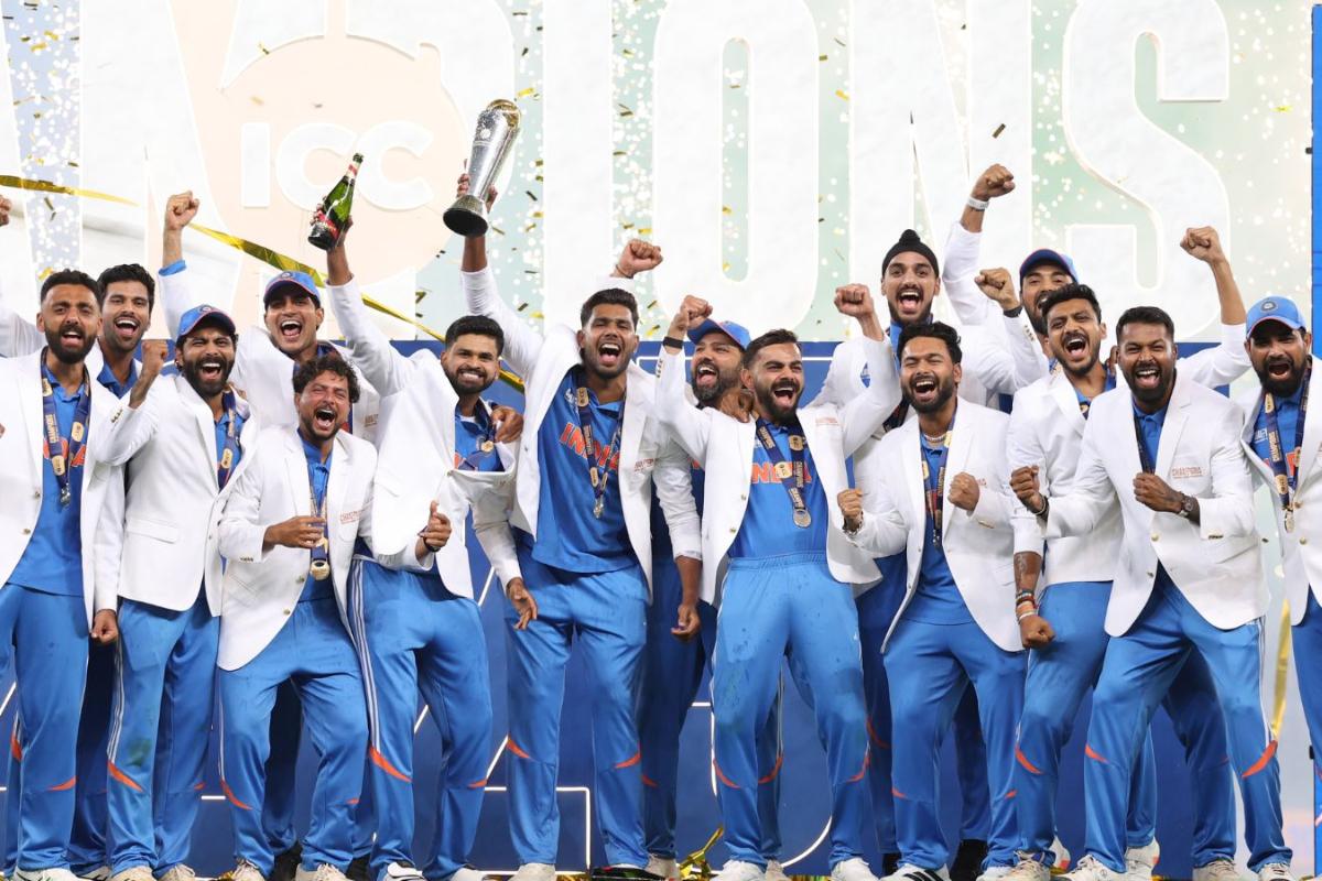 Indian players celebrate with the Champions Trophy on Sunday, March 9.