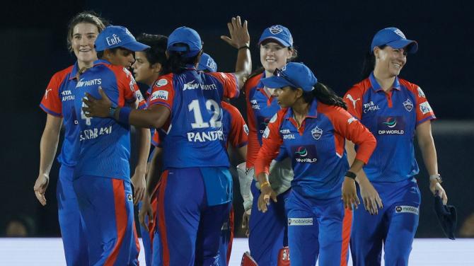 Delhi Capitals players celebrates the wicket of Mumbai Indians captain Harmanpreet Kaur the Women's Premier League 2025 final at the Brabourne stadium, in Mumbai, on Saturday.