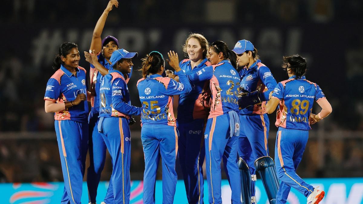 Natalie Sciver-Brunt celebrates with her Mumbai Indians teammates after dismissing Delhi Capitals opener and captain Meg Lanning during the Women's Premier League final at Brabourne Stadium, Mumbai, on Saturday.