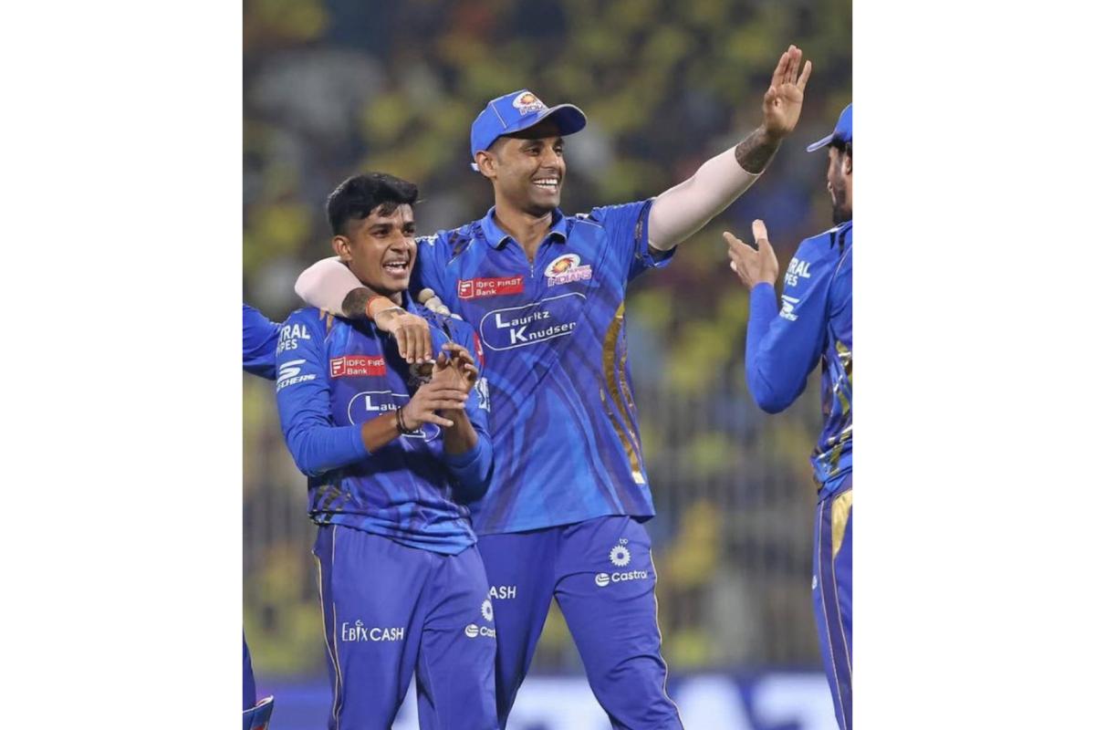  Vignesh Puthu celebrates the wicket of Shivam Dube with MI captain Suryakumar Yadav