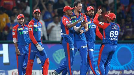 Delhi Capitals players celebrate the fall of a wicket