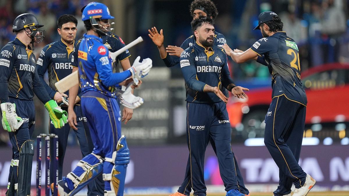  Rashid Khan celebrates with teammates after sending back Will Jacks.