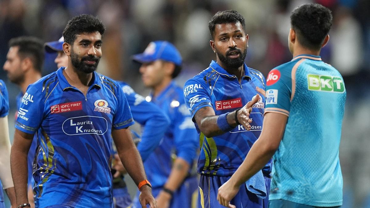 Mumbai Indians's Hardik Pandya and Jasprit Bumrah congratulate Gujarat Titans skipper Shubman Gill as they walk off the field after the IPL match in Mumbai on Tuesday.