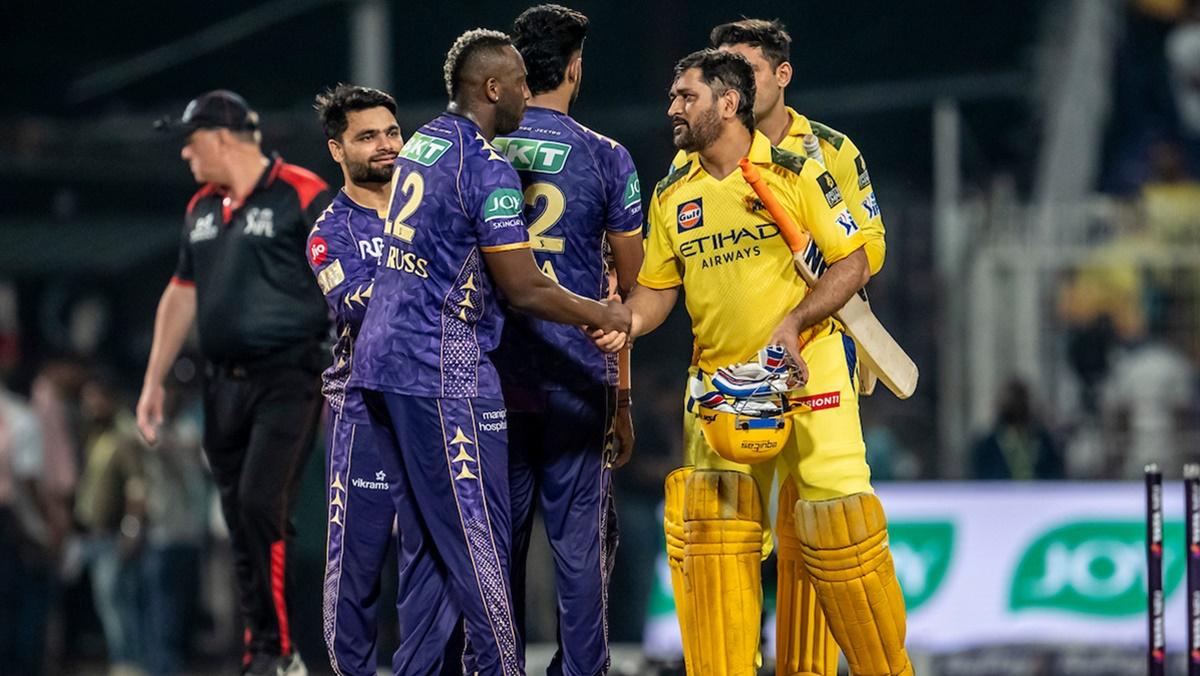 Mahendra Singh Dhoni is congratulated by Andre Russell after Chennai Super Kings beat Kolkata Knight Riders in the IPL match, at the Eden Gardens, in Kolkata, on Wednesday.