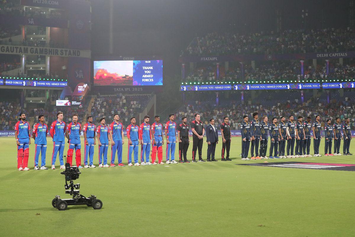 Delhi Capitals and Gujarat Titans players line up for the Indian National Anthem ahead of their IPL game on Sunday