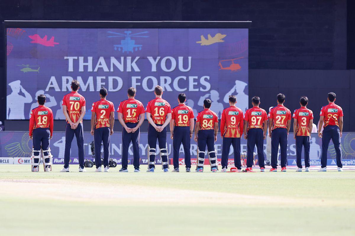 Punjab Kings players sing the national anthem ahead of their match against Rajasthan Royals in Jaipur on Sunday