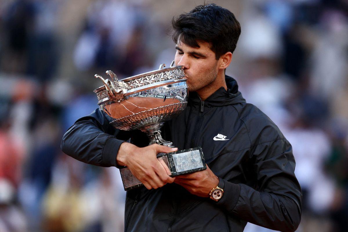 Spain's Carlos Alcaraz celebrates with the trophy after winning the French Open men's singles final