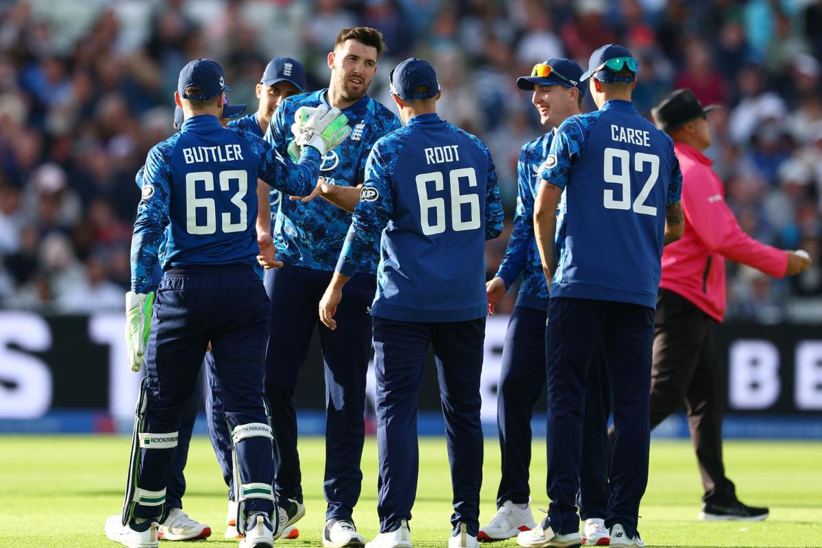 England's Jamie Overton celebrates with teammates after taking the wicket of West Indies' Gudakesh Motie during the 1st ODI at Edgbaston Cricket Ground, Birmingham, on Thursday 