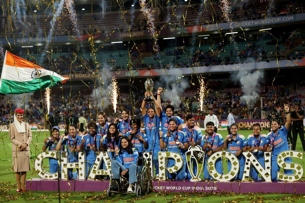 India players celebrate with the trophy after winning the ICC Women's World Cup in Navi Mumbai on Sunday