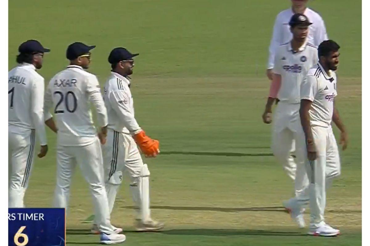 Indian players converge as they  deliberate over an LBW appeal against Temba Bavuma off the bowling of Jasprit Bumrah