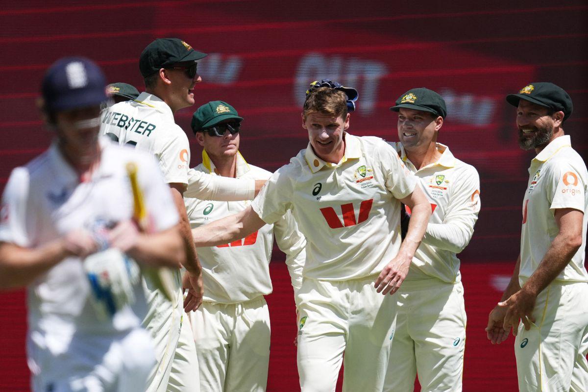 Brendan Doggett celebrates his maiden test wicket with teammates after dismissing England's Harry Brook, caught out by Alex Carey