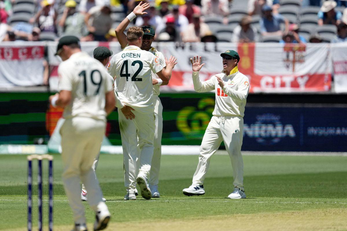 Cameron Green celebrates with teammates after having Ollie Pope out LBW 