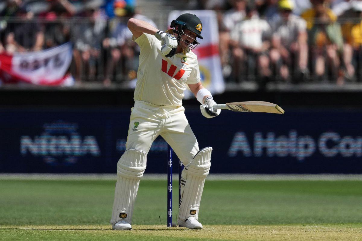 Steve Smith winces in pain as he hit on the arm by Gus Atkinson 