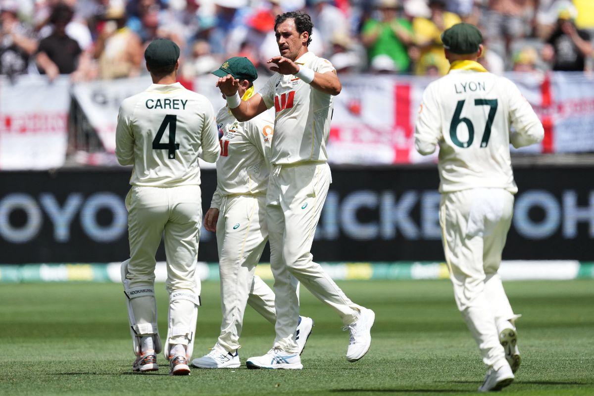 Australia's Mitchell Starc celebrates with teammates after taking the wicket of England's Jamie Smith