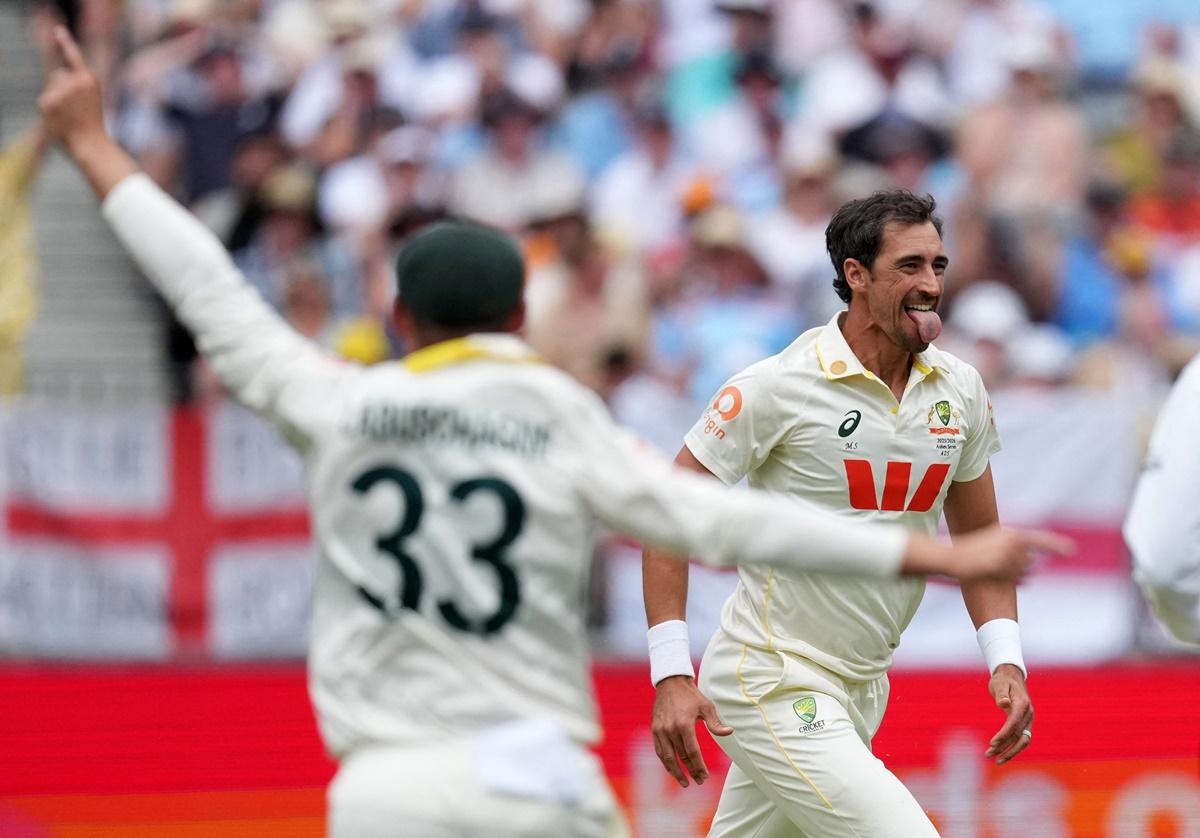 Australia pacer Mitchell Starc celebrates dismissing England opener Zak Crawley in the second innings