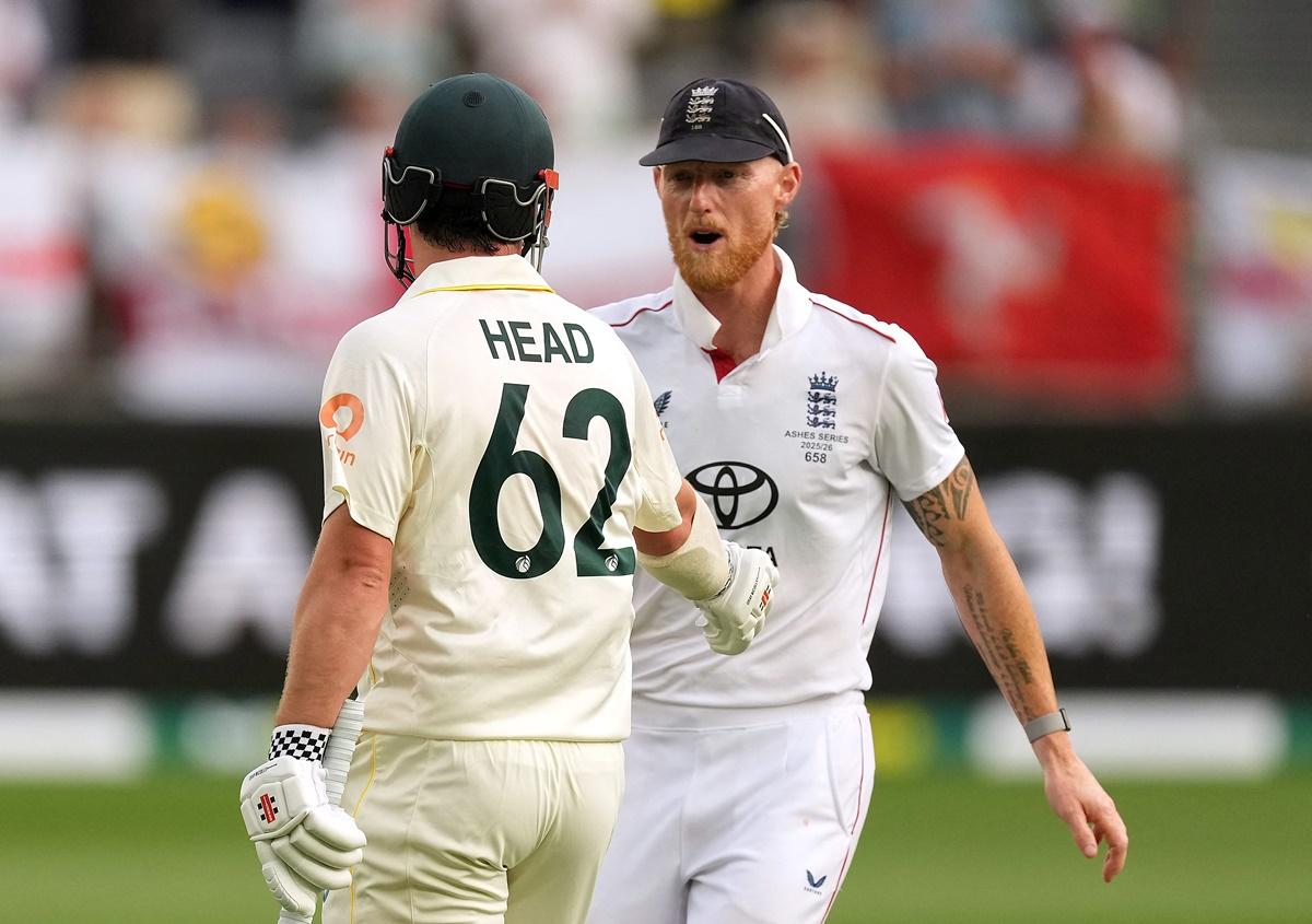 Travis Head is congratulated by Ben Stokes as he walks back to the pavilion after being dismissed for 123.