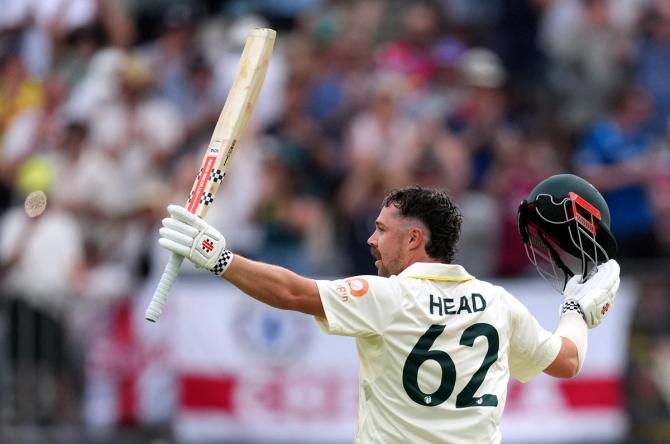 Travis Head celebrates after completing his century on Day 2 of the first Ashes Test at Perth Stadium, Perth, Australia, on Saturday.