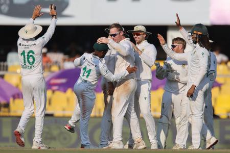 Simon Harmer celebrates the wicket of Washington Sundar