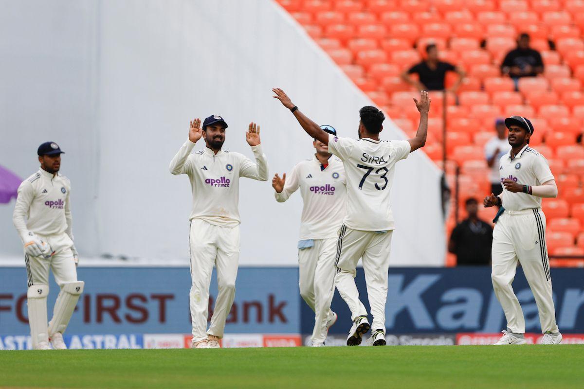 Mohammed Siraj gets a round of high-fives after shattering Brandon King's stumps