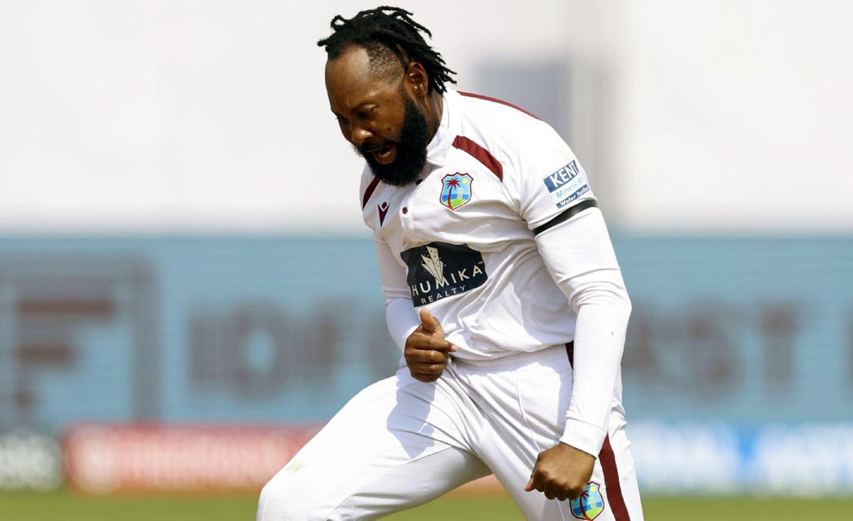 West Indies' Jomel Warrican celebrates on dismissing KL Rahul