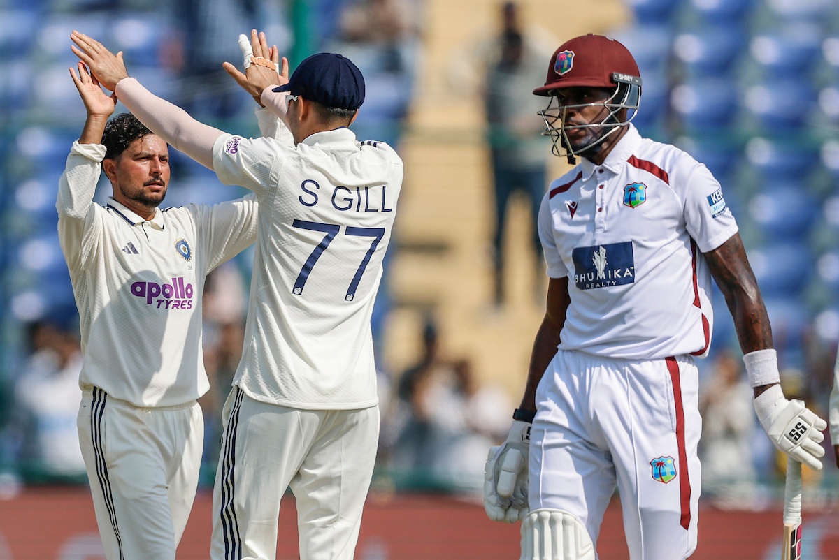 Kuldeep Yadav celebrates the wicket of Justin Greaves