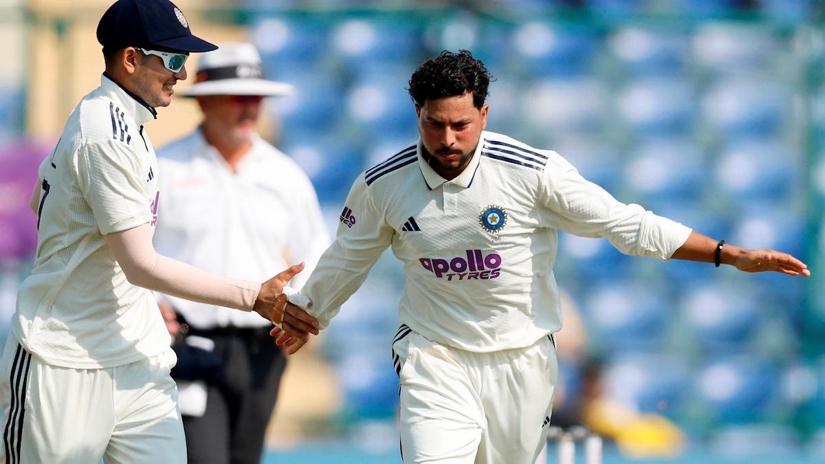 Kuldeep Yadav of India celebrates the wicket of Shai Hope of West Indies.