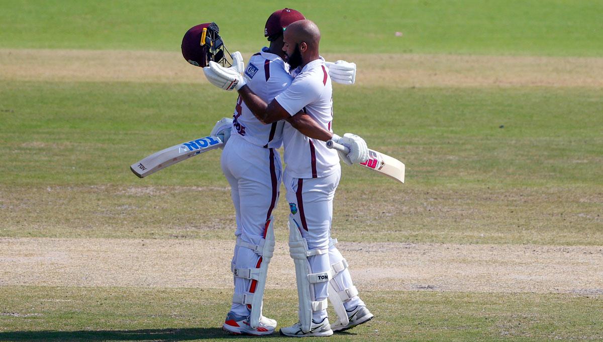 John Campbell celebrates his century with Shai Hope John Campbell celebrates his century with Shai Hope
