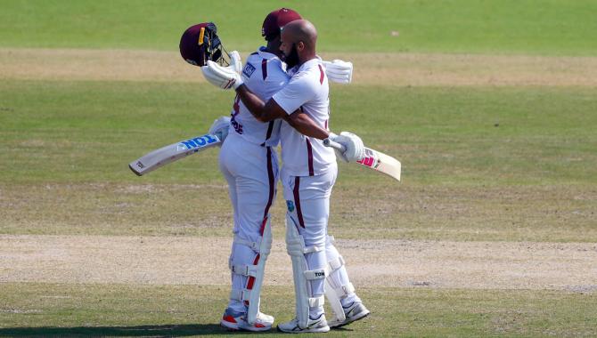 John Campbell celebrates his century with Shai Hope John Campbell celebrates his century with Shai Hope