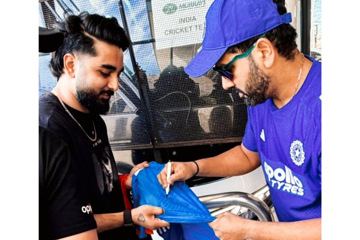 Rohit Sharna signs a jersey for Shahil