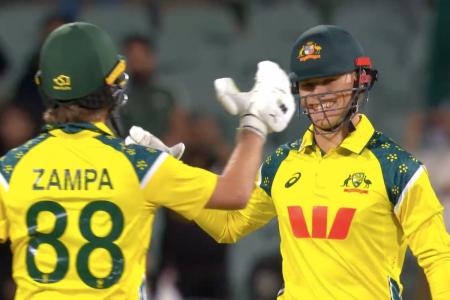 Cooper Connolly and Adam Zampa celebrate after beating India by 2 wickets in Adelaide on Thursday