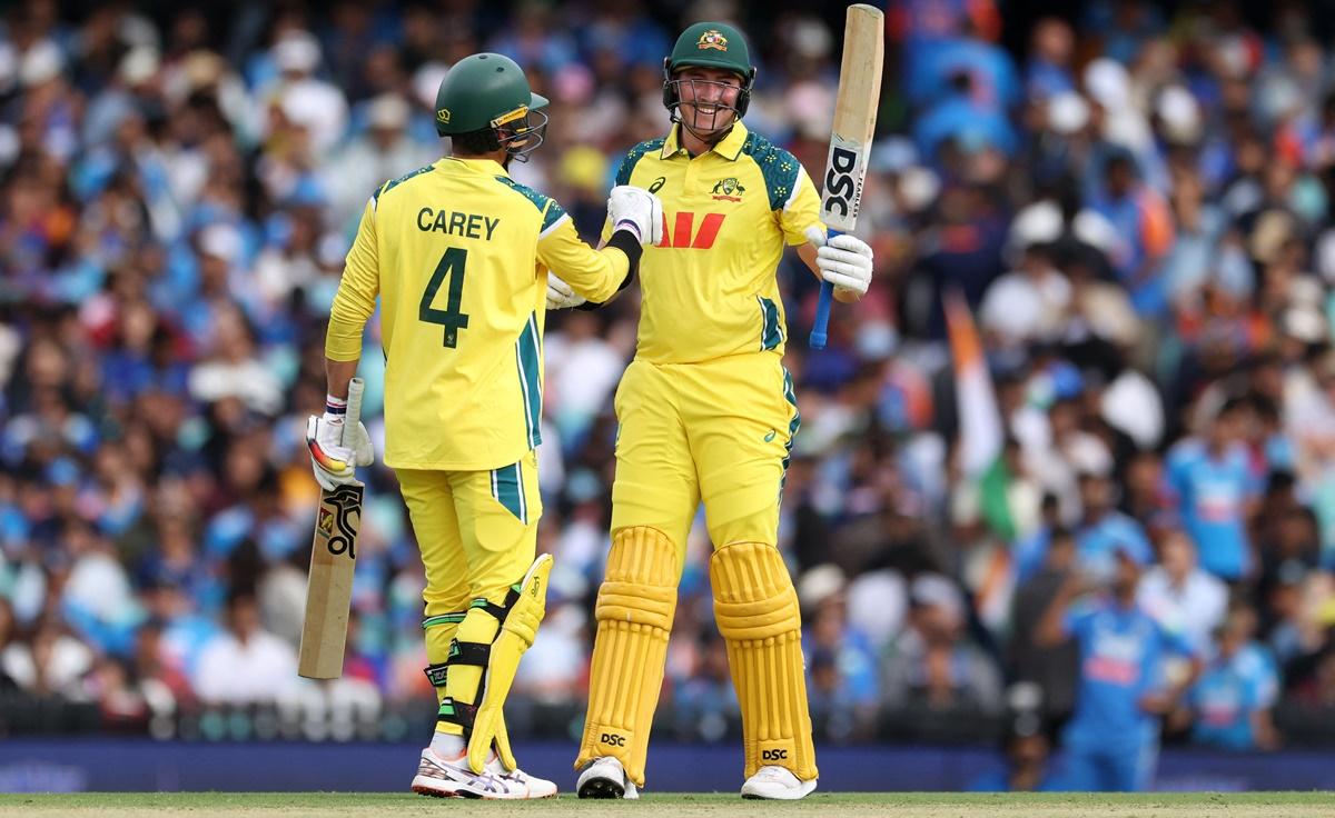 Matt Renshaw celebrates with Alex Carey after completing a half century.