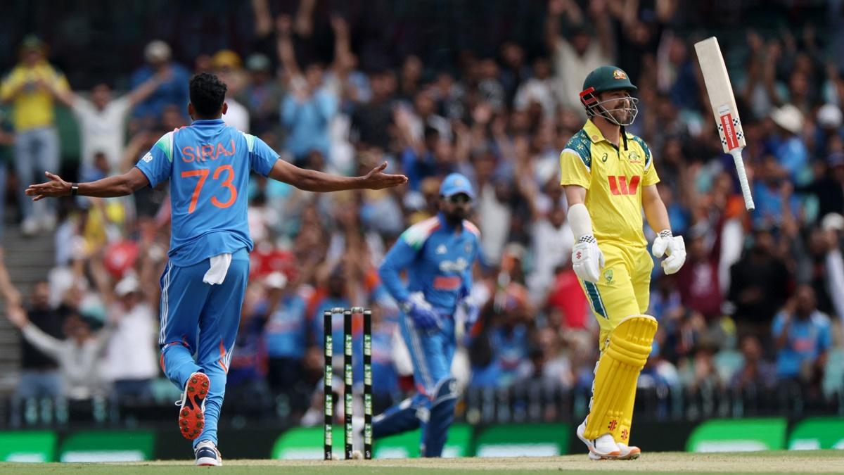 Australia opener Travis Head reacts after being dismissed by Mohammed Siraj.