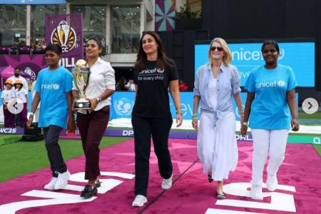 Former India captain Mithali Raj and Bollywood superstar Kareena Kapoor Khan walk out with the trophy ahead of the ICC Women's World Cup semi-final in Navi Mumbai on Thursday