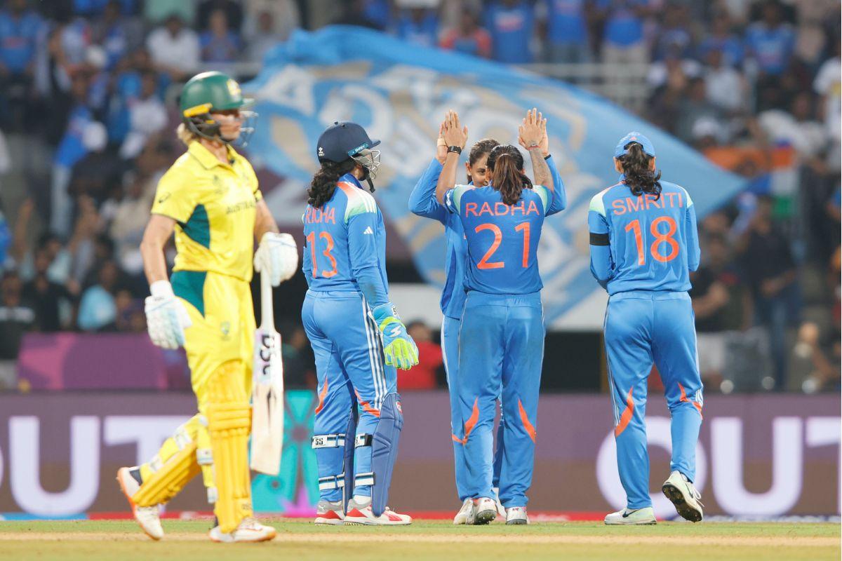 Radha Yadav celebrates with teammates on dismissing Ellyse Perry