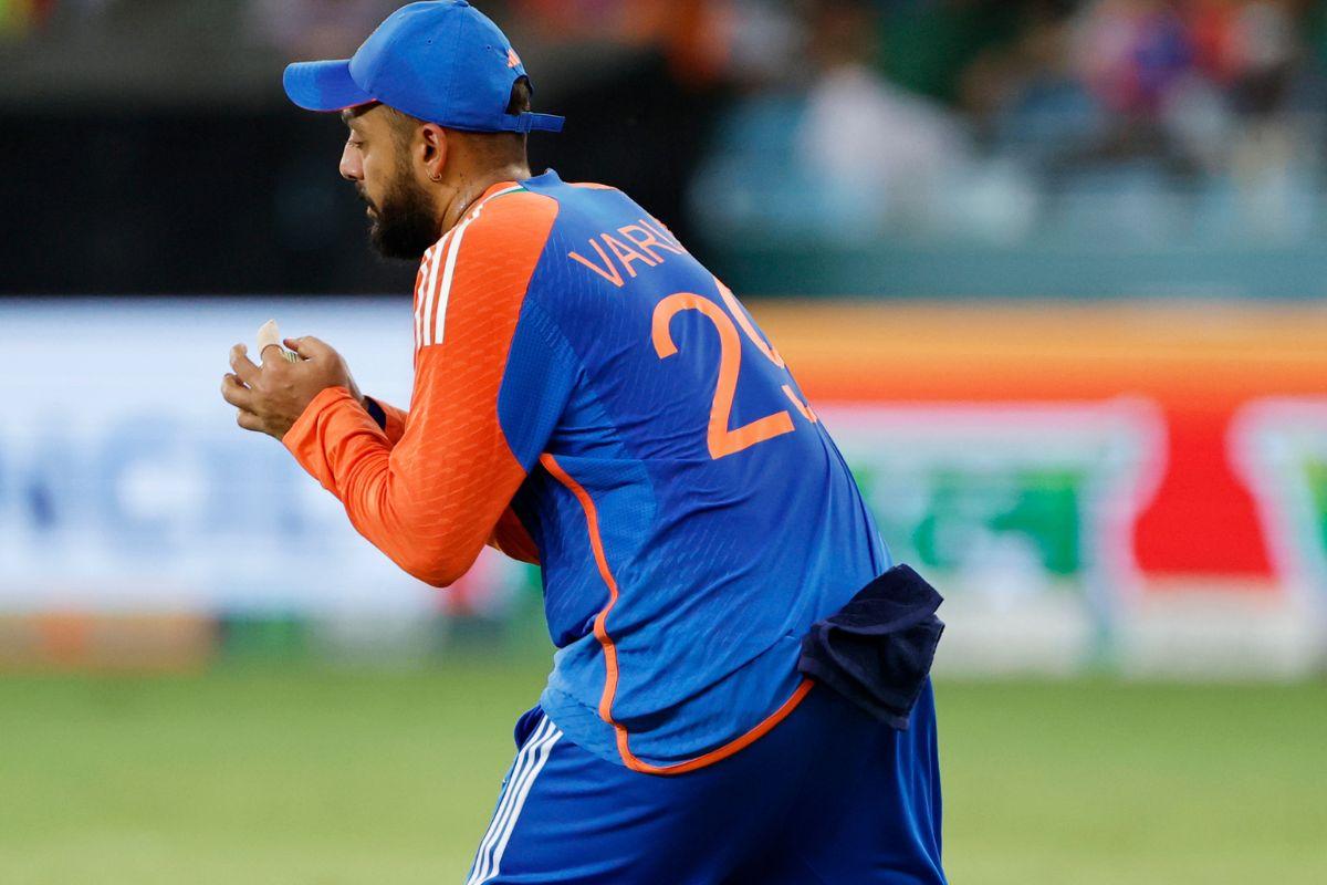India's Varun Chakaravarthy takes the catch to dismiss Pakistan's Hussain Talat during their match in the Super Fours (A1 v A2) of Asia Cup 2025, at Dubai International Cricket Stadium in Dubai on Sunday