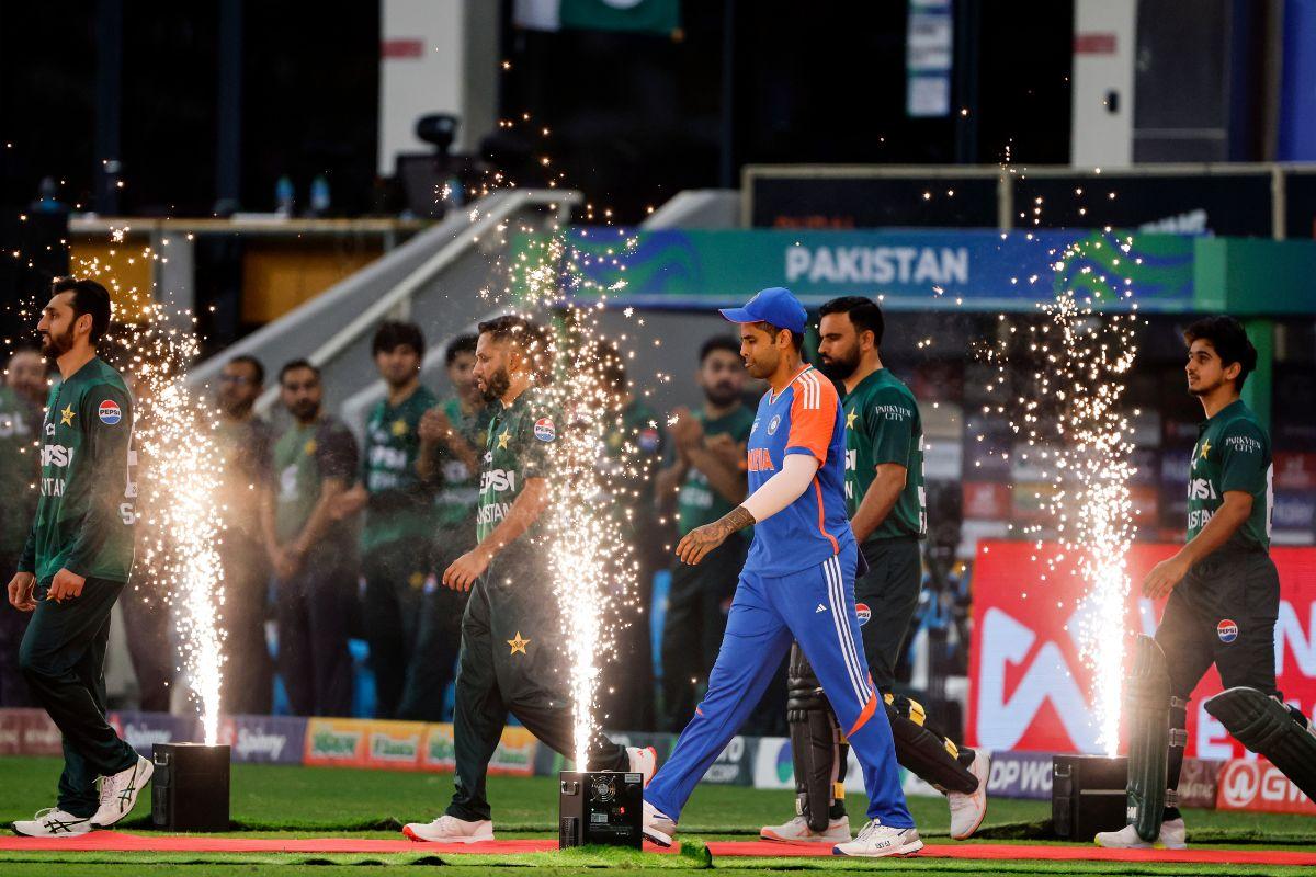 Indian and Pakistani players walk into the ground before the start of the Asia Cup 2025 final match, at Dubai International Cricket Stadium in Dubai on Sunday