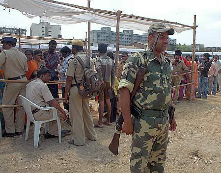 Paramilitary soldier stands guard at a polling booth